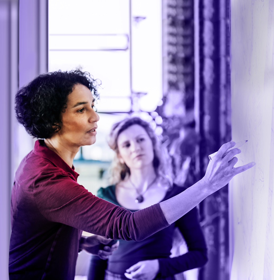 Viatris 'About Us' webpage featuring company mission statement on purple background alongside image of healthcare professional presenting