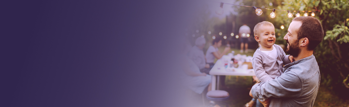 A father and child laughing in garden; text overlay: 'At Viatris, we empower people worldwide to live healthier at every stage of life'